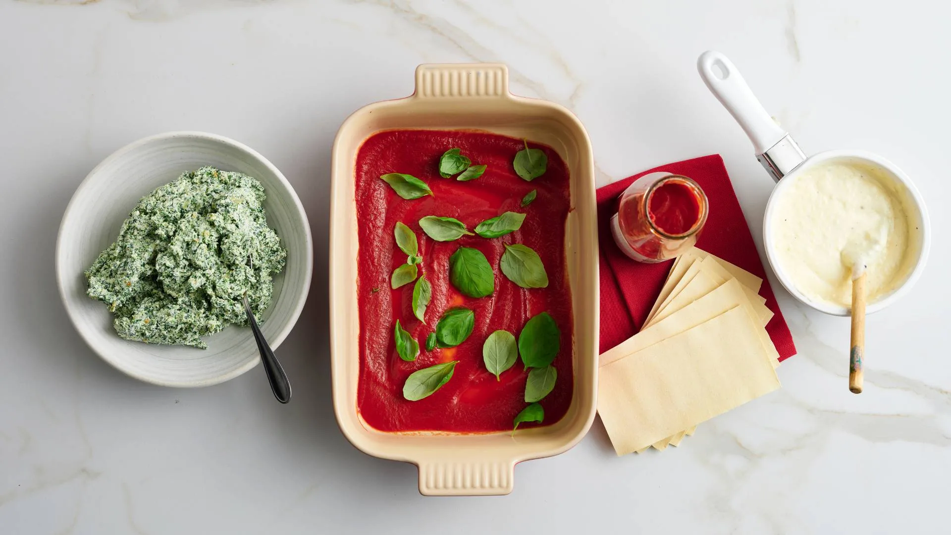 Assembling the spinach and ricotta lasagne