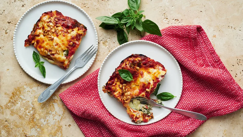 Slices of lasagne served on plates