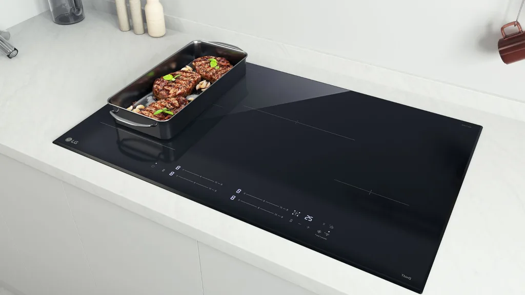 LG's induction cooktop in kitchen with pan of food