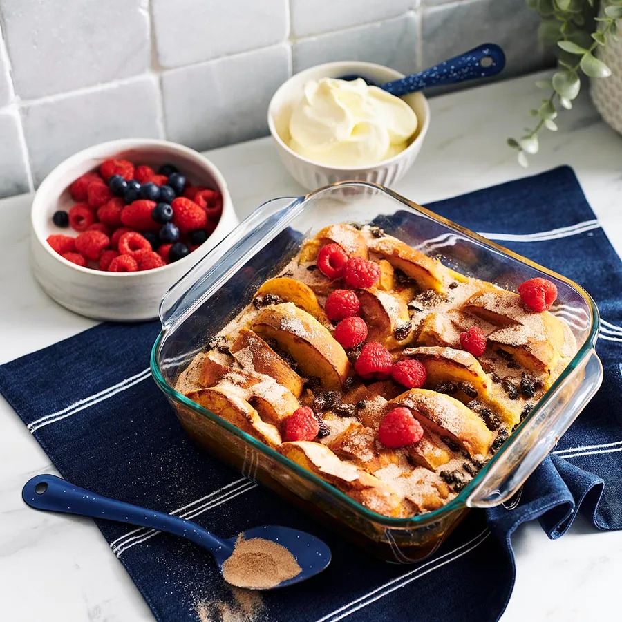 Julie Goodwin's bread and butter pudding with bowls of berries and cream