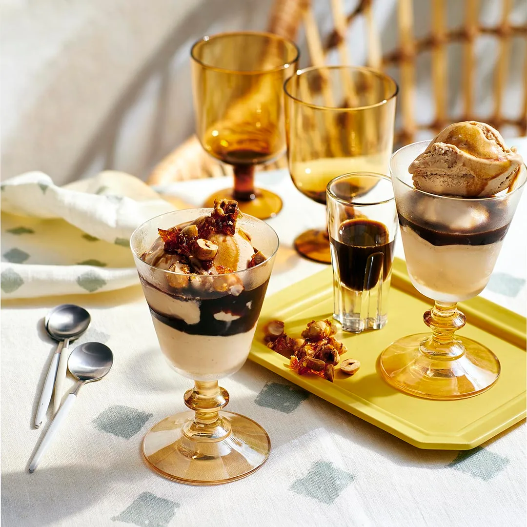 Affogato with candied walnuts on a yellow tray