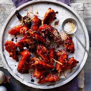 Sticky chicken wings sprinkled with sesame seeds