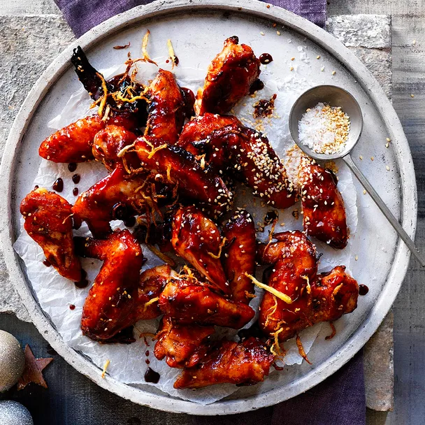 Sticky chicken wings sprinkled with sesame seeds