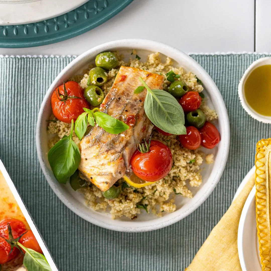 Baked barramundi fillets with cherry tomatoes, green olives & herbs