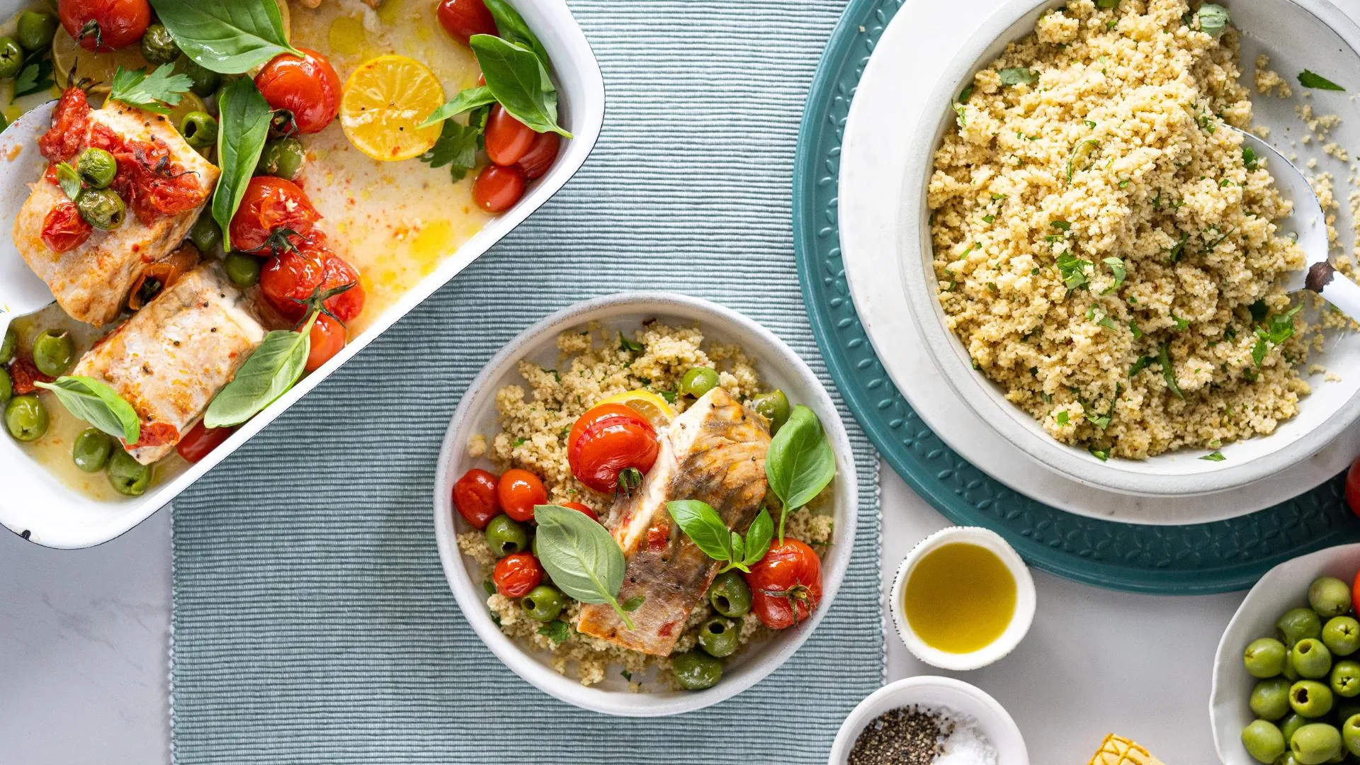 Baked barramundi fillets with cherry tomatoes, green olives & herbs