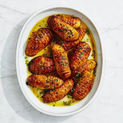 Hasselback potatoes with chive & thyme butter