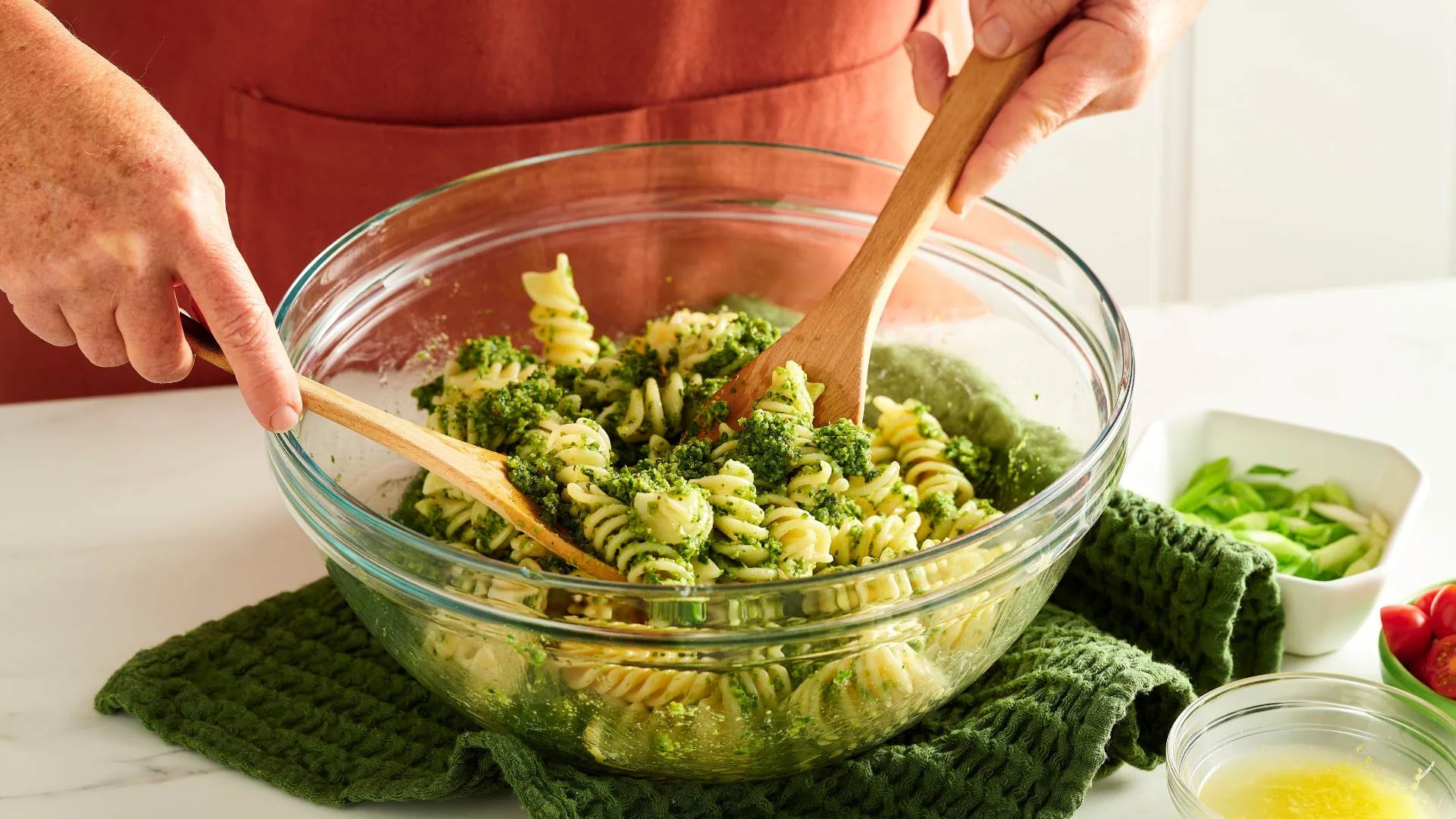 Tossing pesto through the pasta