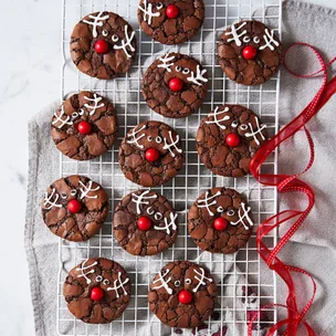 rudolph brownie cookies on a white wire cooling rack