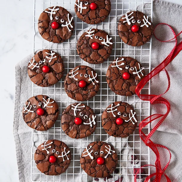 rudolph brownie cookies on a white wire cooling rack