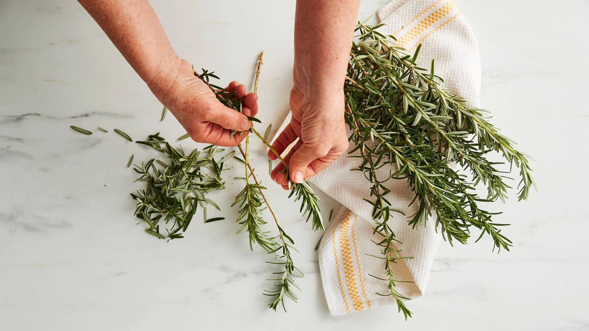 Prepare rosemary by removing bottom leaves from stems