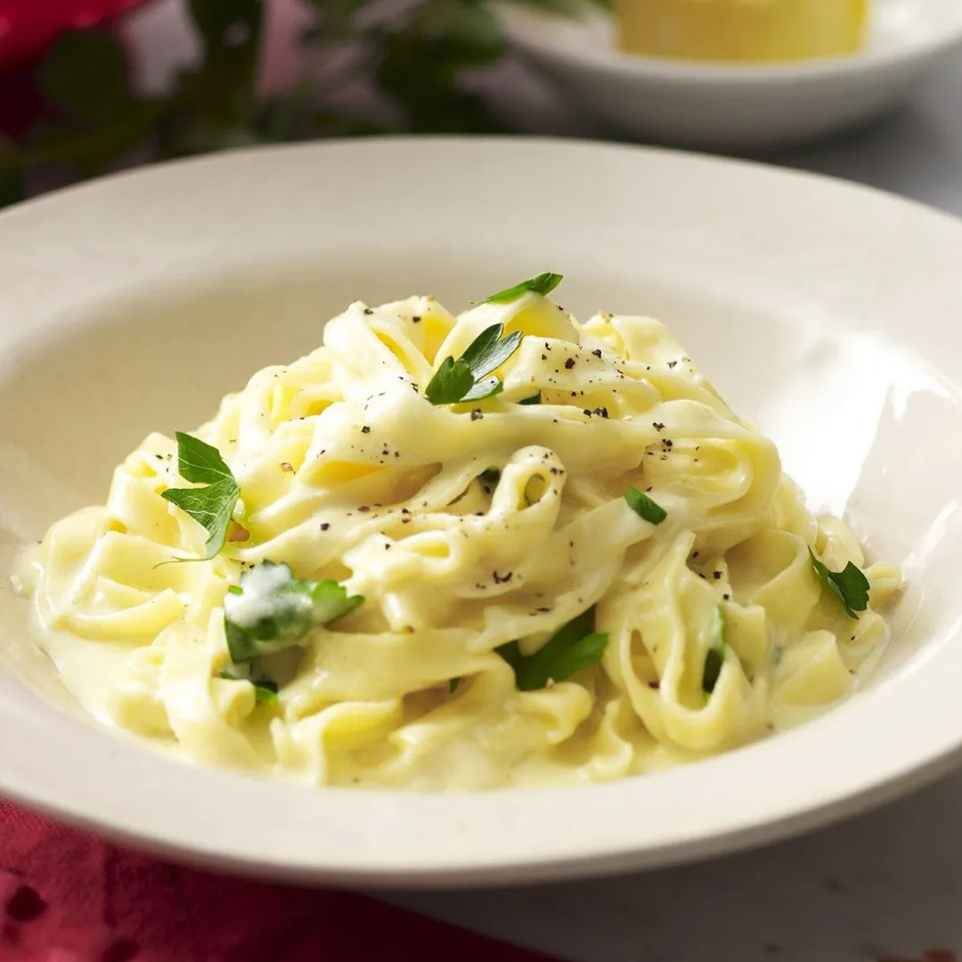 Fettuccine alfredo in a white bowl