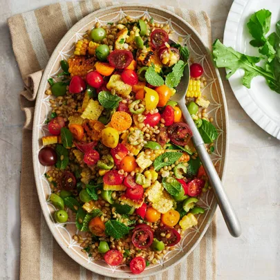 Grain salad with corn, olives & tomatoes