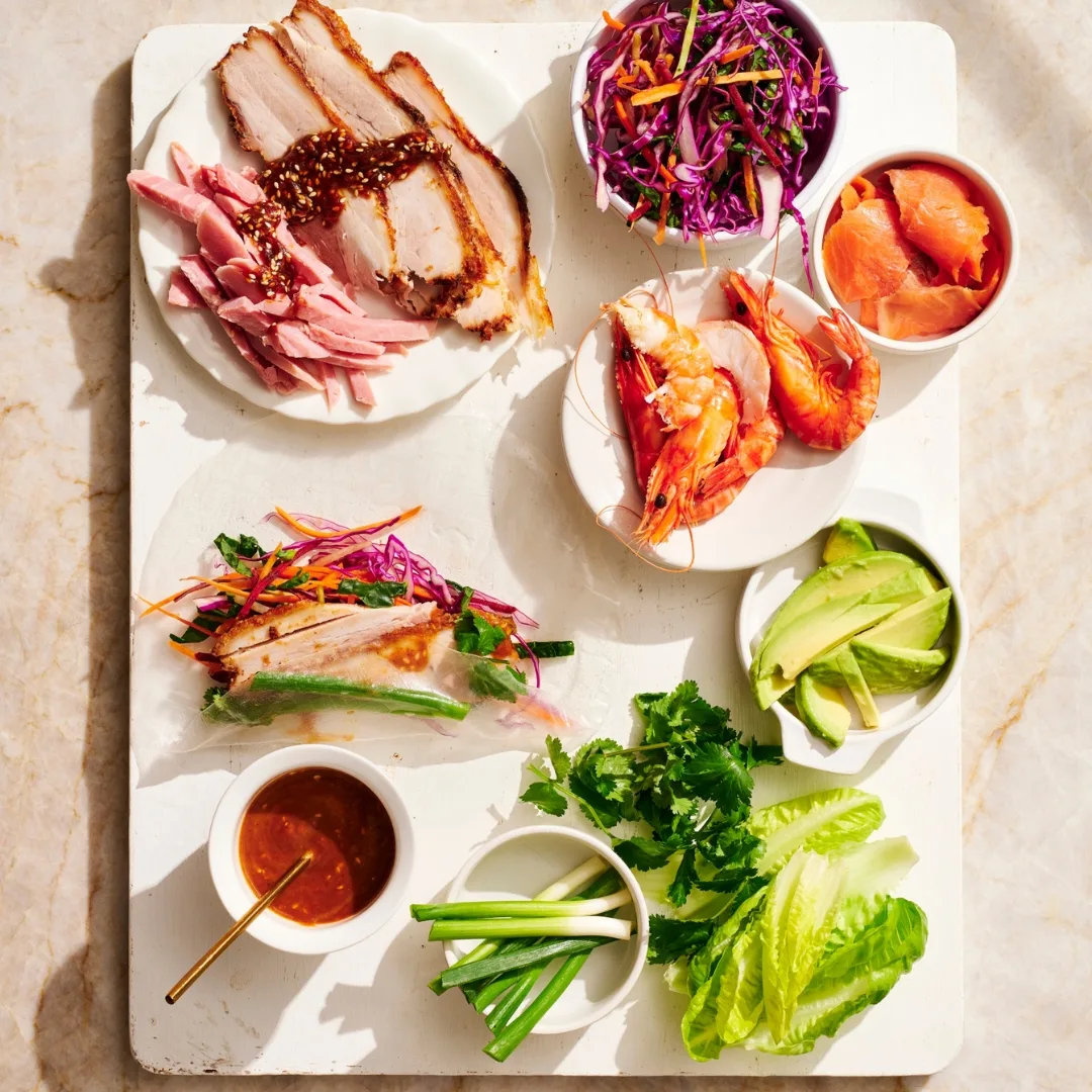 ingredients for Pick-your-protein rice paper roll recipe on a chopping board