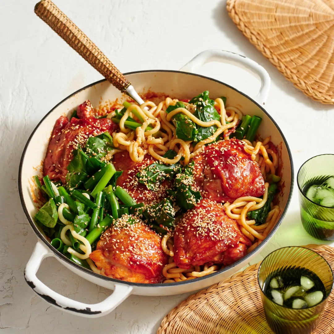 char siu chicken by Julie Goodwin in a white pan with a wooden spoon