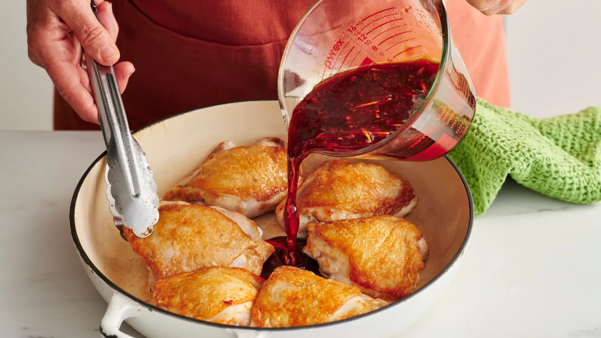 char siu chicken by Julie Goodwin step photo of pouring red wine into a frying pan with chicken