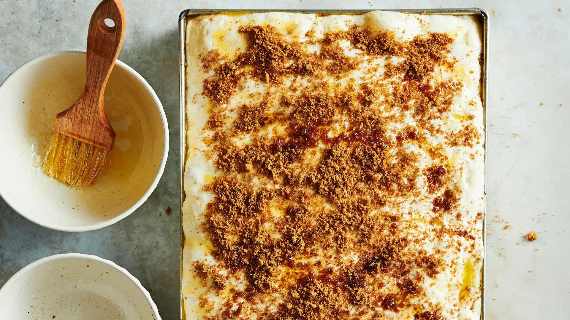 cinnamon focaccia dough in a baking tin