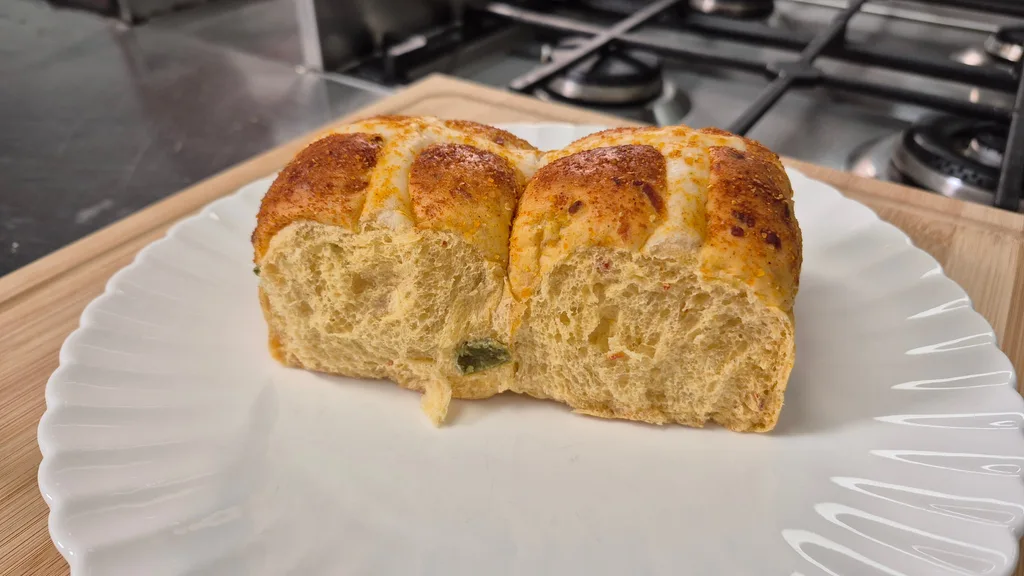 two doritos hot cross buns on a white plate