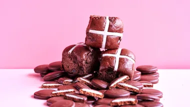 Mint Slice hot cross buns on a pile of Arnott's mint slice biscuits