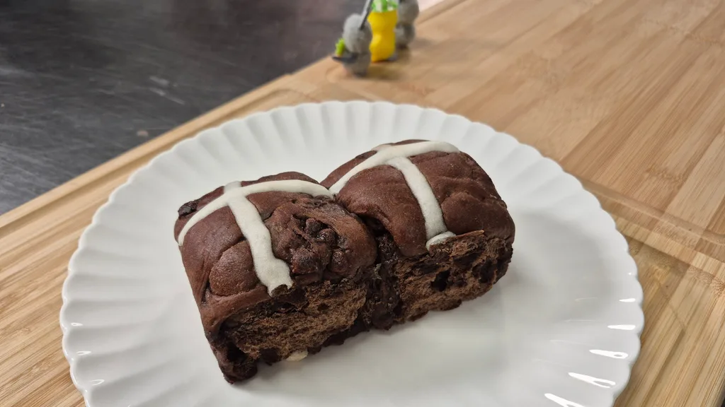 Mint Slice hot cross buns on a white plate