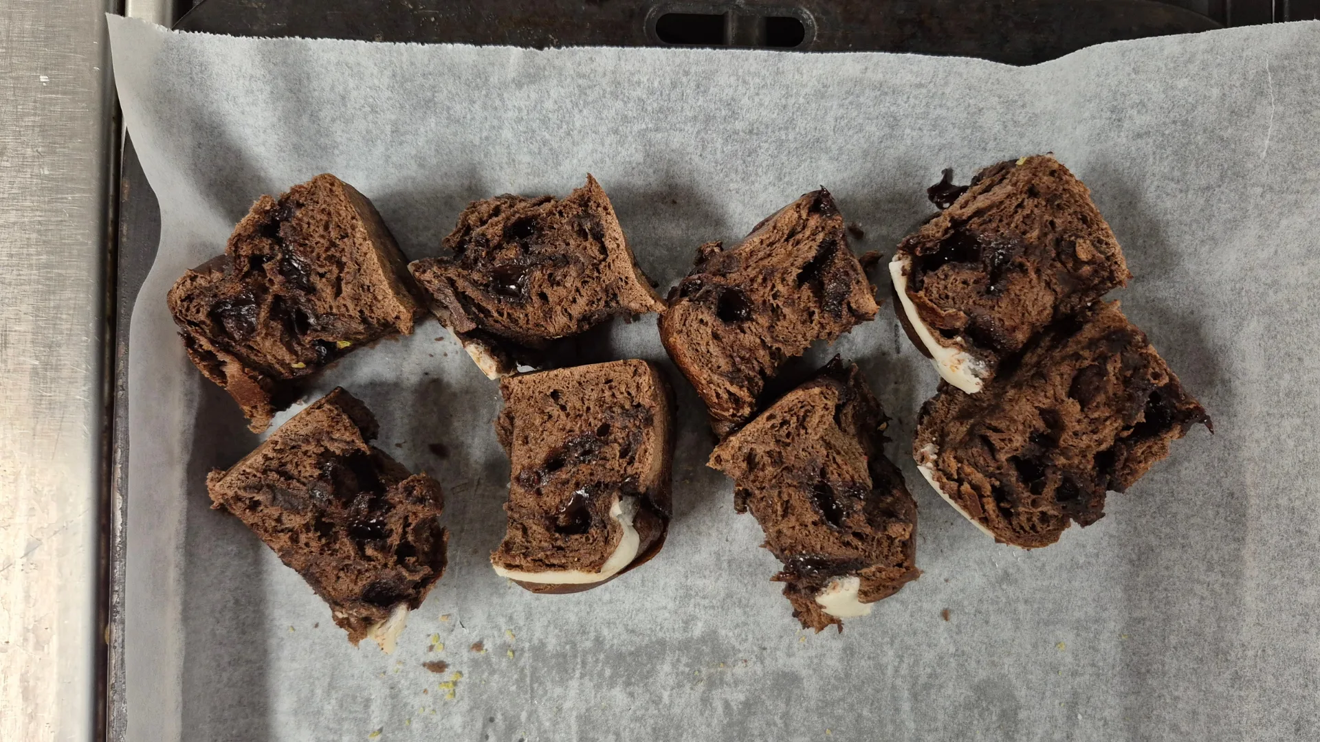 Mint Slice hot cross buns chopped into pieces on a baking tray