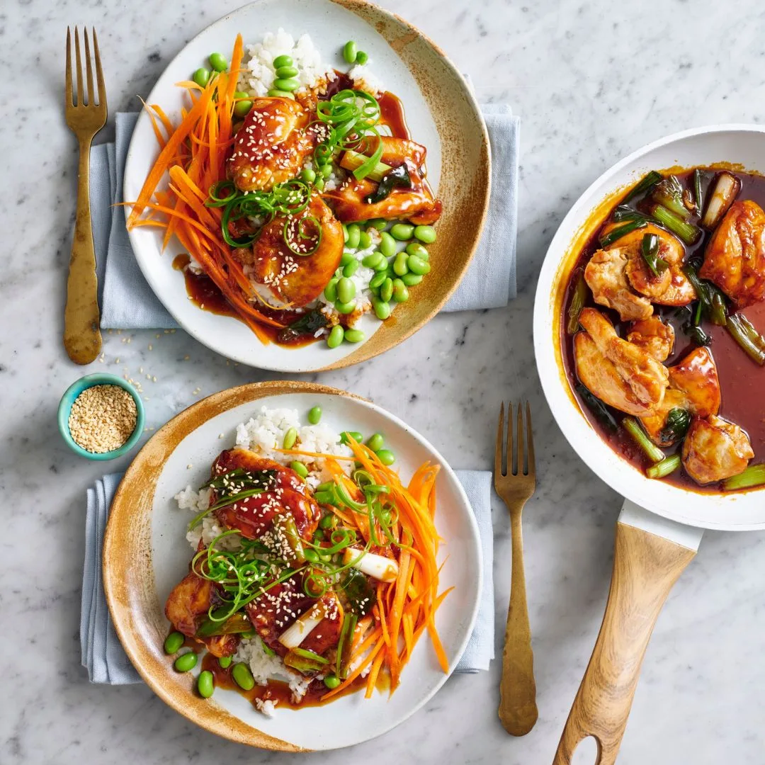 teriyaki chicken bowls and a frying pan with teriyaki chicken