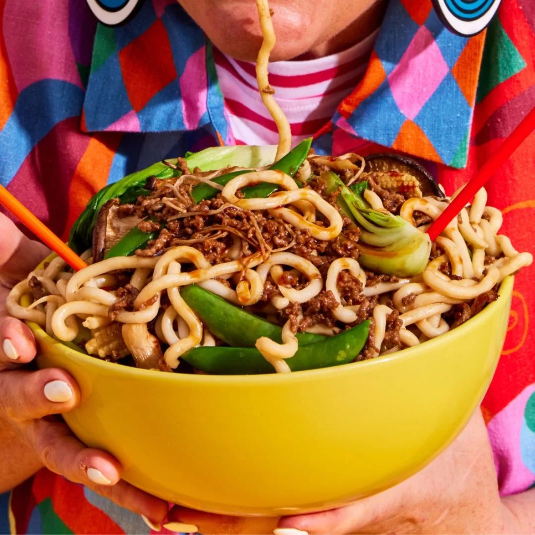 Steph de Sousa holding a bowl of teriyaki beef mince stir fry
