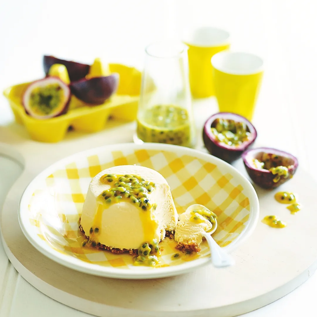 julie goodwin mini ice cream cheesecakes on a yellow and white plate, topped with passionfruit