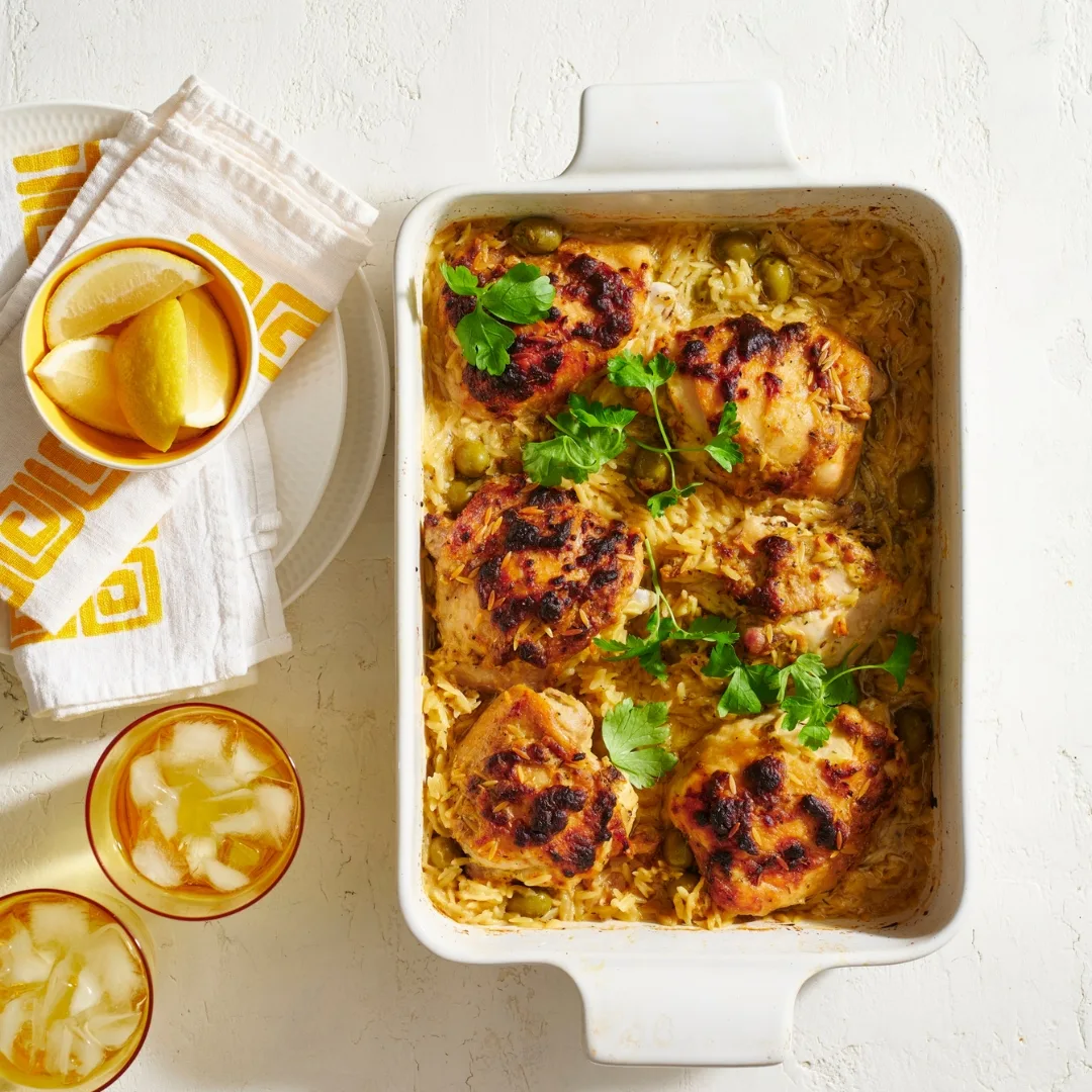 Greek lemon chicken in a white baking dish
