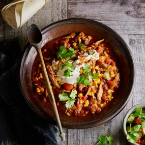 slow cooker mexican chicken with beans in a bowl