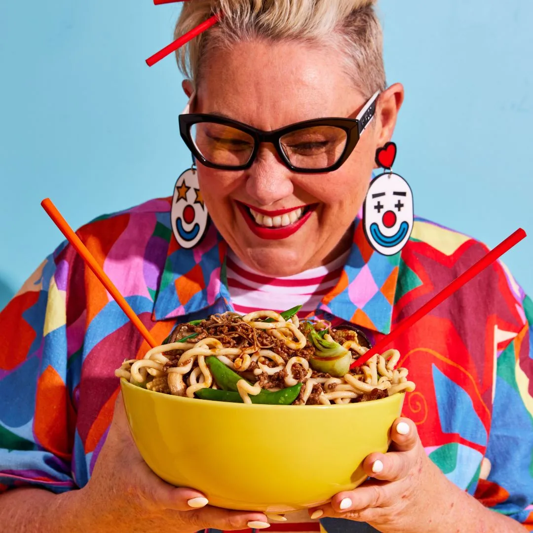 Steph de Sousa holding a bowl of teriyaki beef mince stir fry