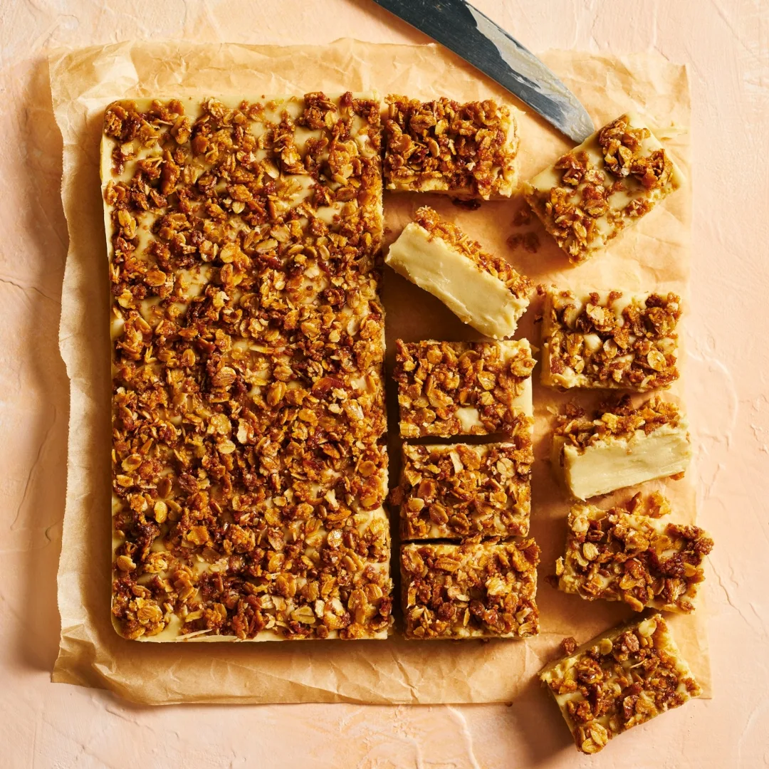 Caramel fudge with a crumble topping half cut into square
