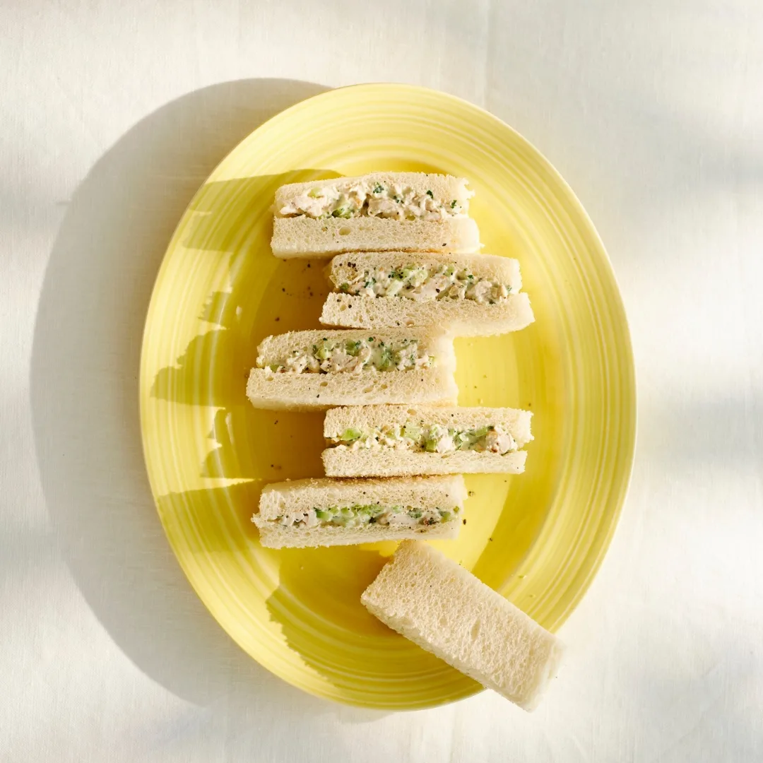 chicken high tea sandwiches on a yellow plate