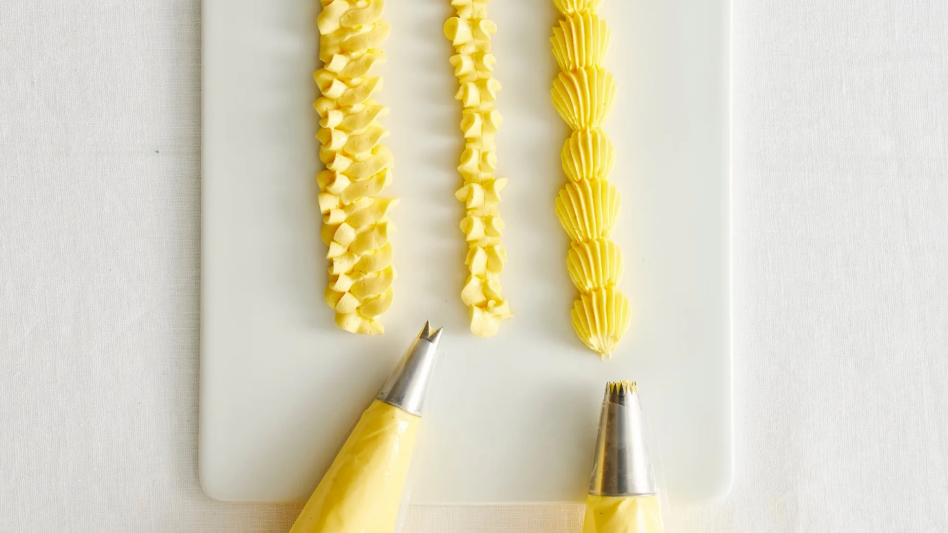 three piped lines of yellow icing