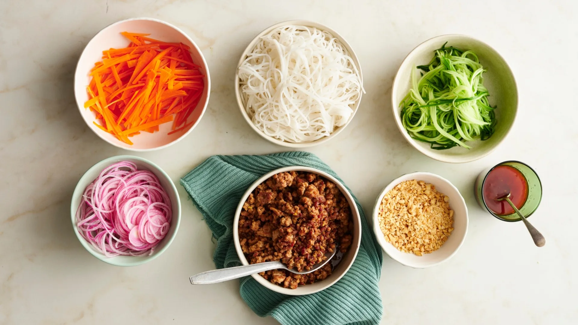 six bowls with ingredients for minced pork noodles