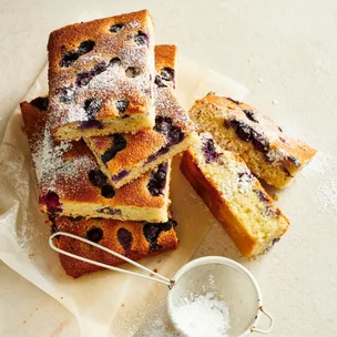 Blueberry friand slice, cut into large pieces and dusted with icing sugar