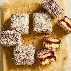 cherry coconut lamingtons, with a few broken in half to show the jam centres