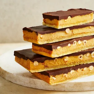Stacked slices of hazelnut millionare's shortbread