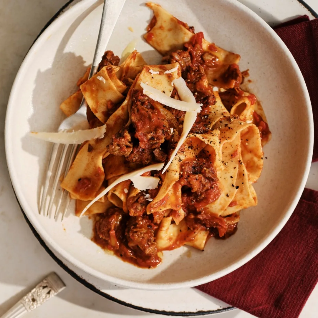 spice lamb ragu with pasta on a serving plate