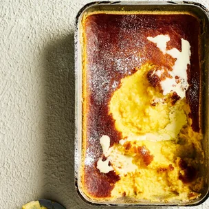 lemon and coconut delicious pudding drizzled with cream