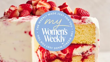two layer sponge cake topped with strawberries with my womens weekly logo