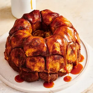 Orange caramel monkey bread with sauce drizzled over