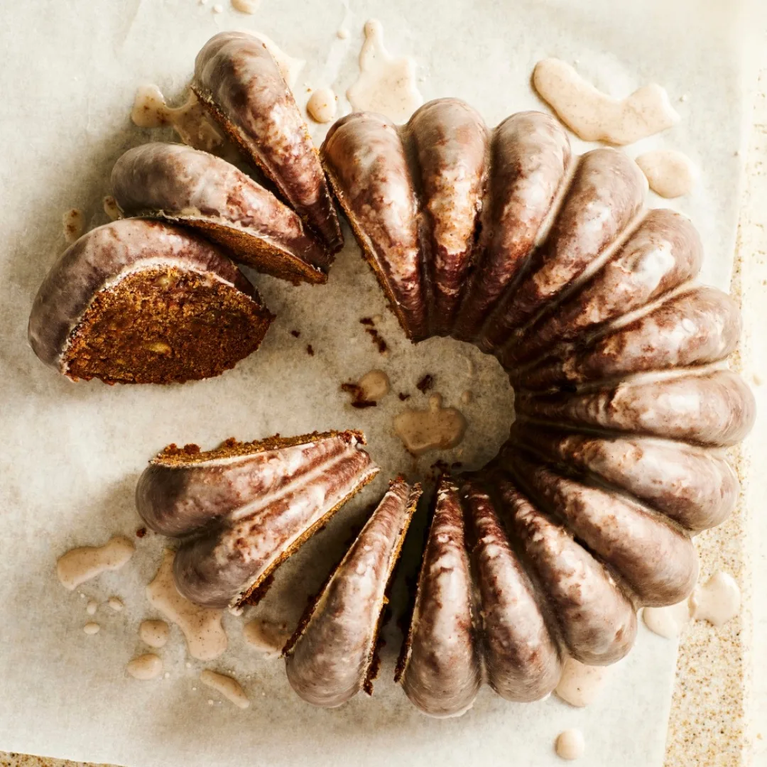 Pear & pecan gingerbread cake with slices cut out