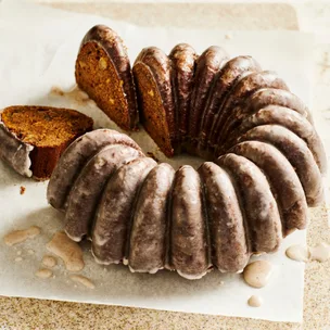 Pear & pecan gingerbread cake with slices cut out