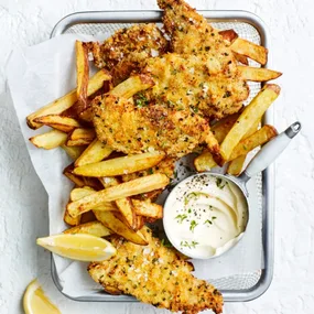 air fryer pork schnitzel dishes with chips and aioli and a metal tray