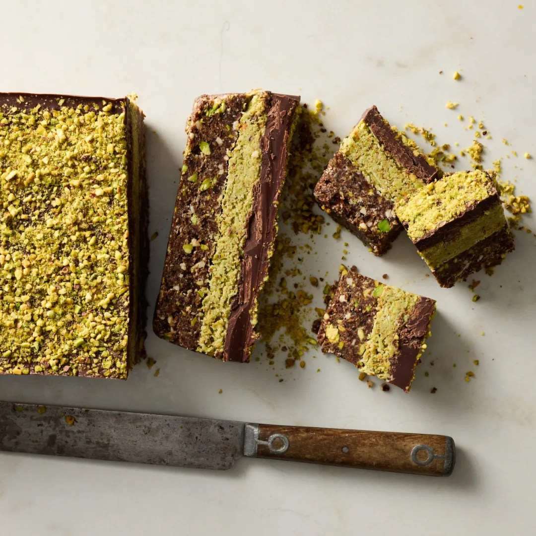 dubai pistachio chocolate no bake slice cut into pieces