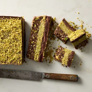 dubai pistachio chocolate no bake slice cut into pieces