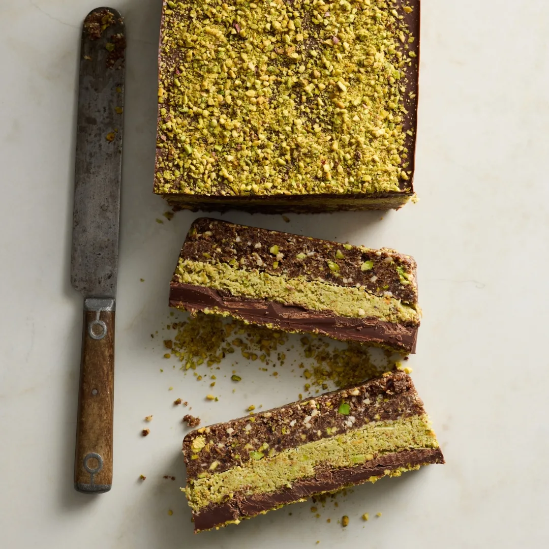 dubai pistachio chocolate no bake slice cut into pieces
