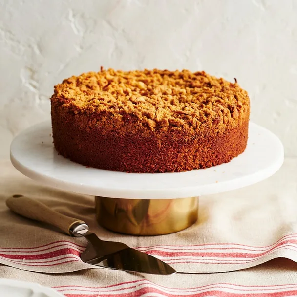 Julie Goodwin's coconut milk cake on a white cake stand