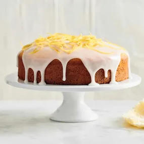 tea cake recipes: lemon cake on a white cake stand
