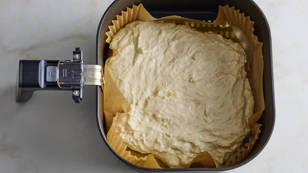 focaccia mixture in air fryer basket